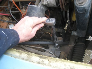 Illustration for article titled '71 Midget Donates Lever Shocks To 20R Sprite Hell Project